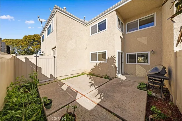 a backyard of a house with seating space