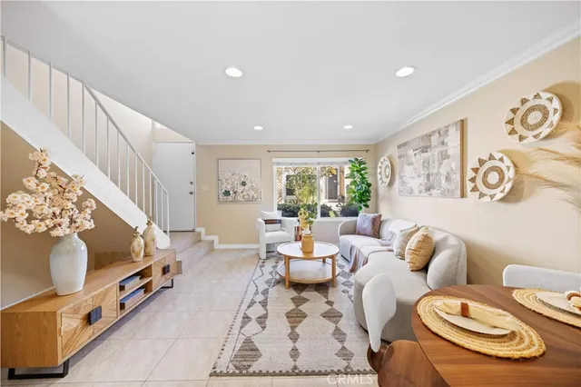 a living room with furniture and a rug