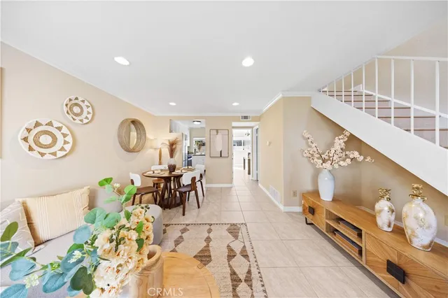 a living room with furniture and a clock