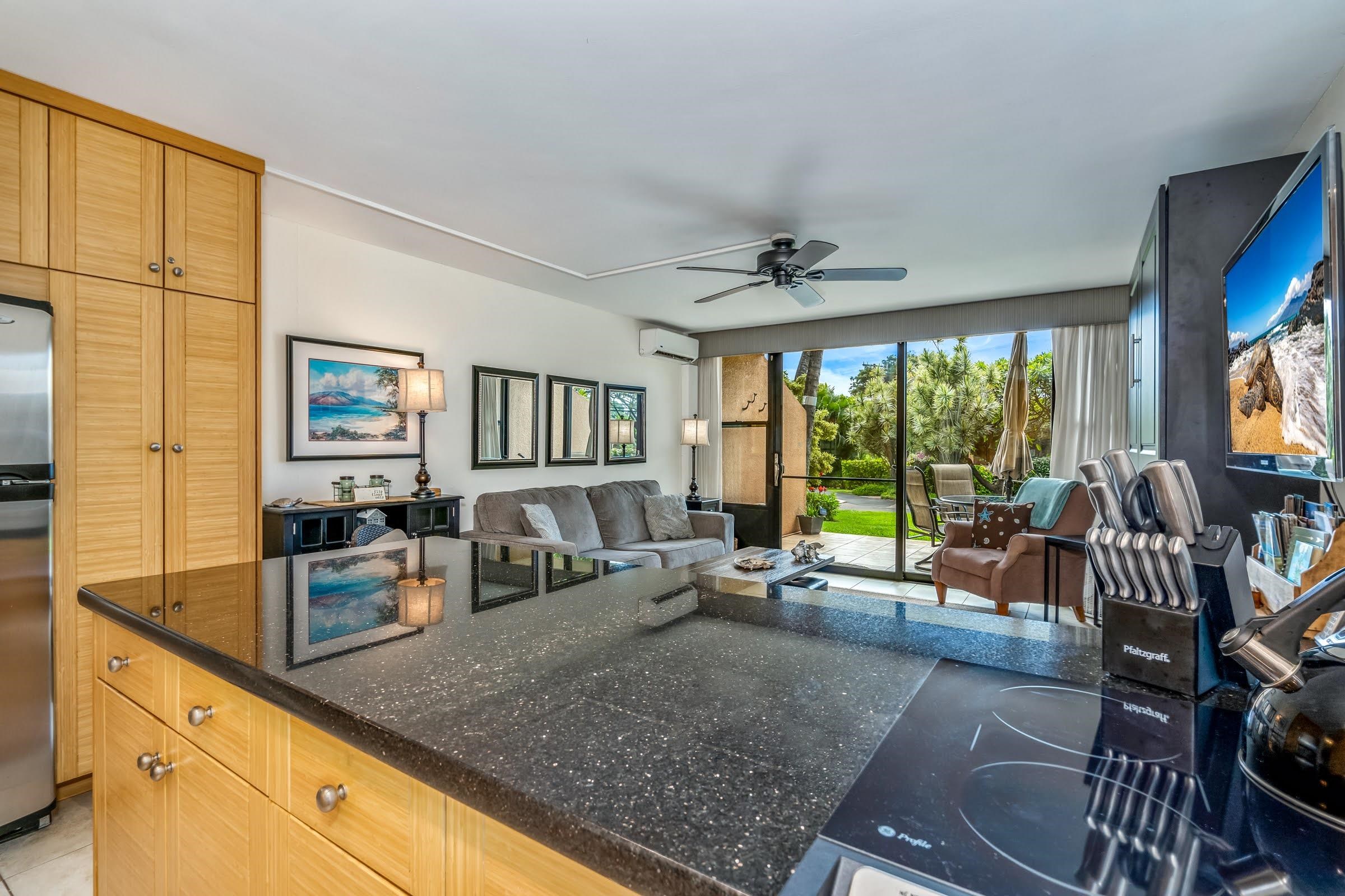 2191 South Kihei Road, Unit 1110 Kihei, HI 96753 - Photo 4 of 20 a living room with furniture large window and flat screen tv