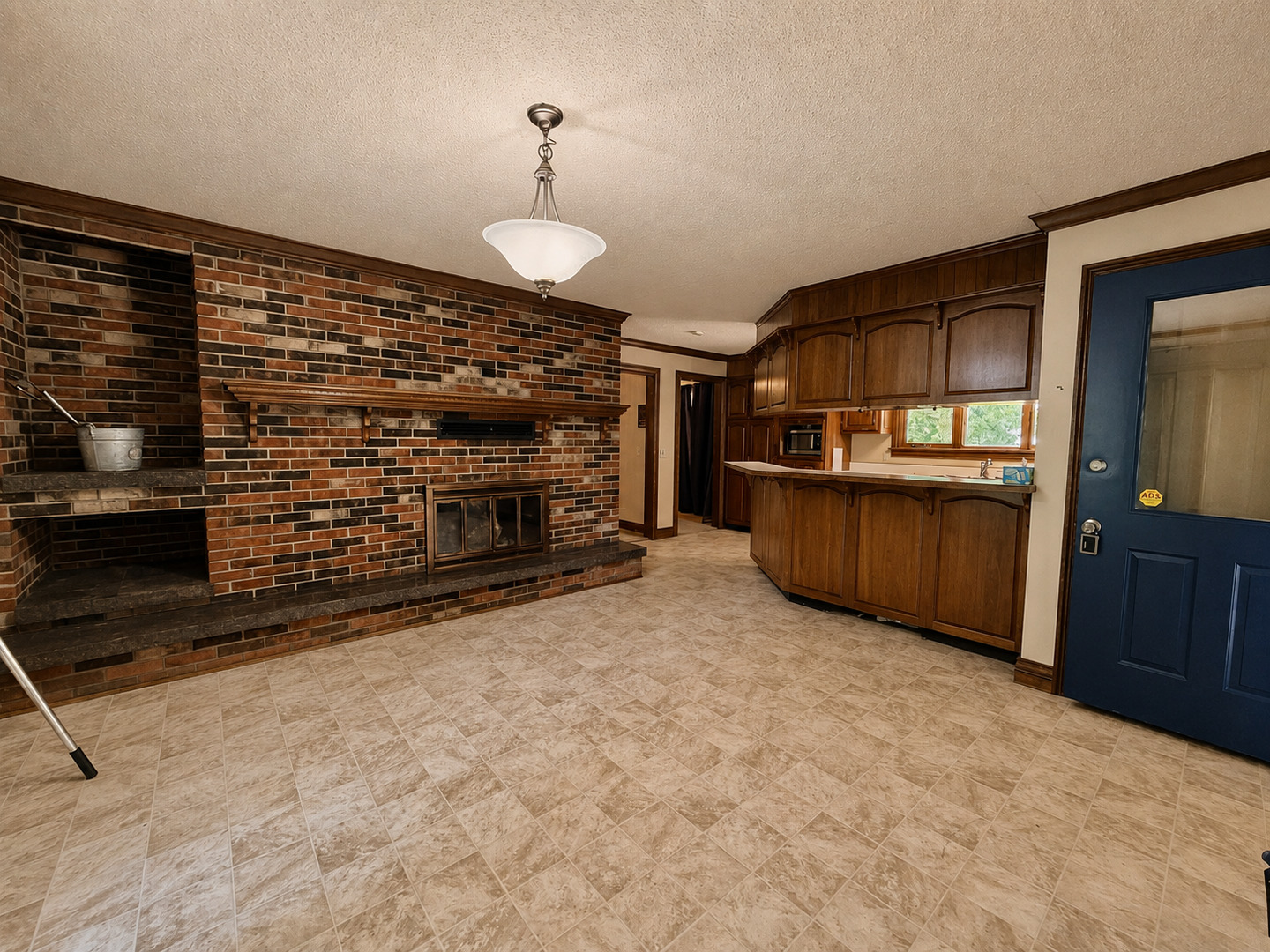 5996 South US 45 Road Metropolis, IL 62960 - Photo 14 of 41 a view of an empty room and kitchen with fireplace