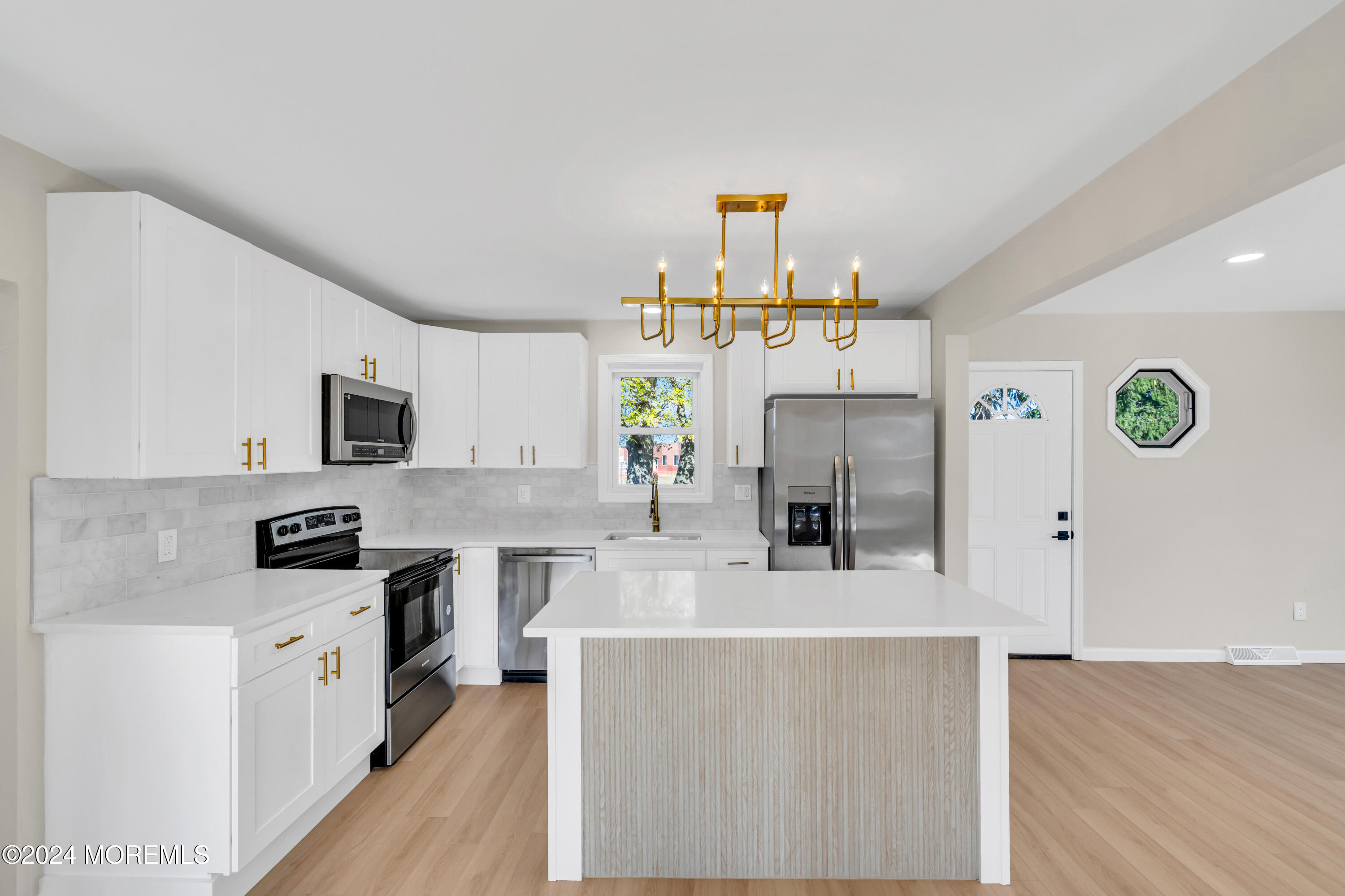 2053 Bustleton Road Burlington, NJ 08016 - Photo 14 of 55 a kitchen with kitchen island stainless steel appliances a sink stove and microwave