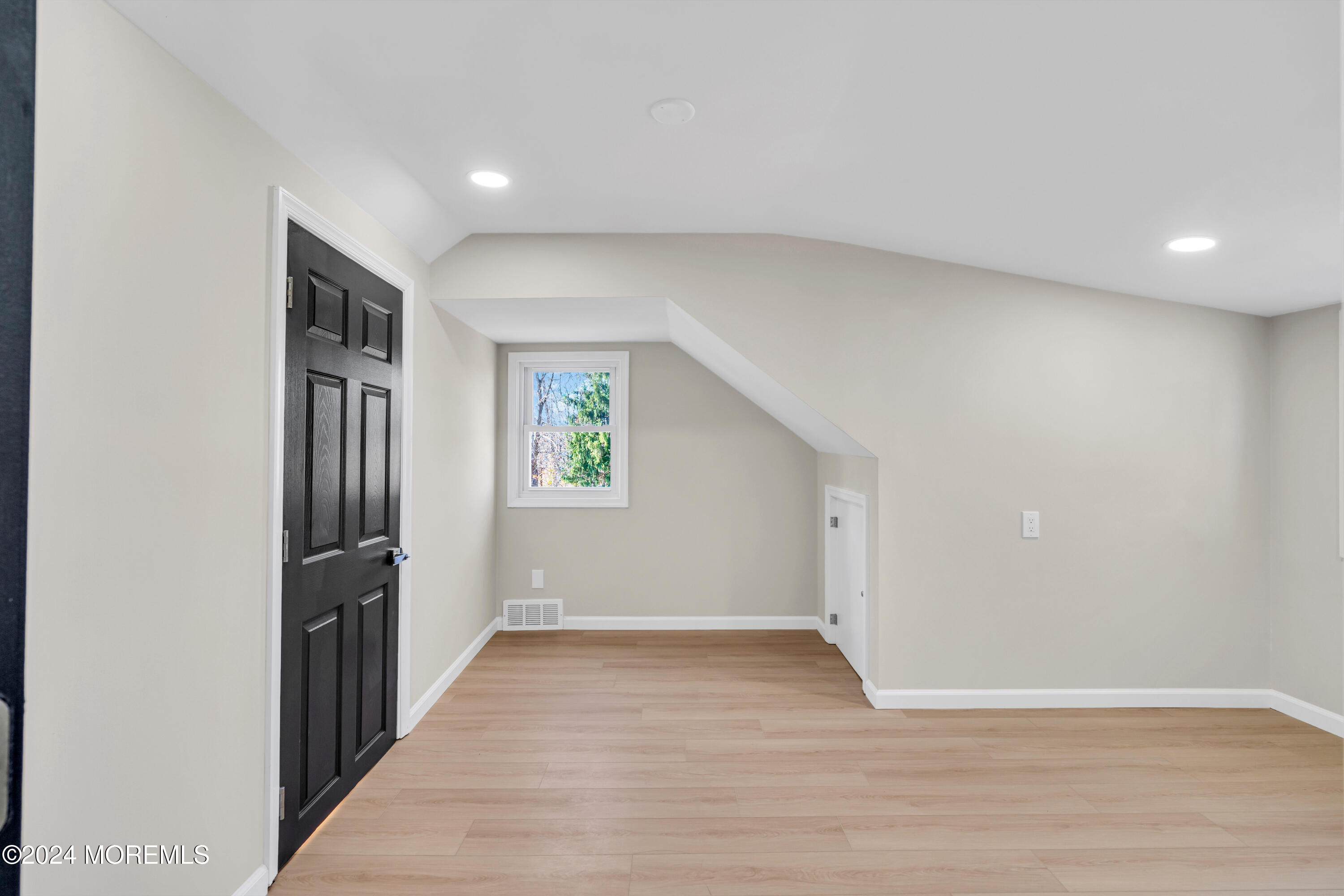 2053 Bustleton Road Burlington, NJ 08016 - Photo 42 of 55 a view of an empty room with wooden floor and a window
