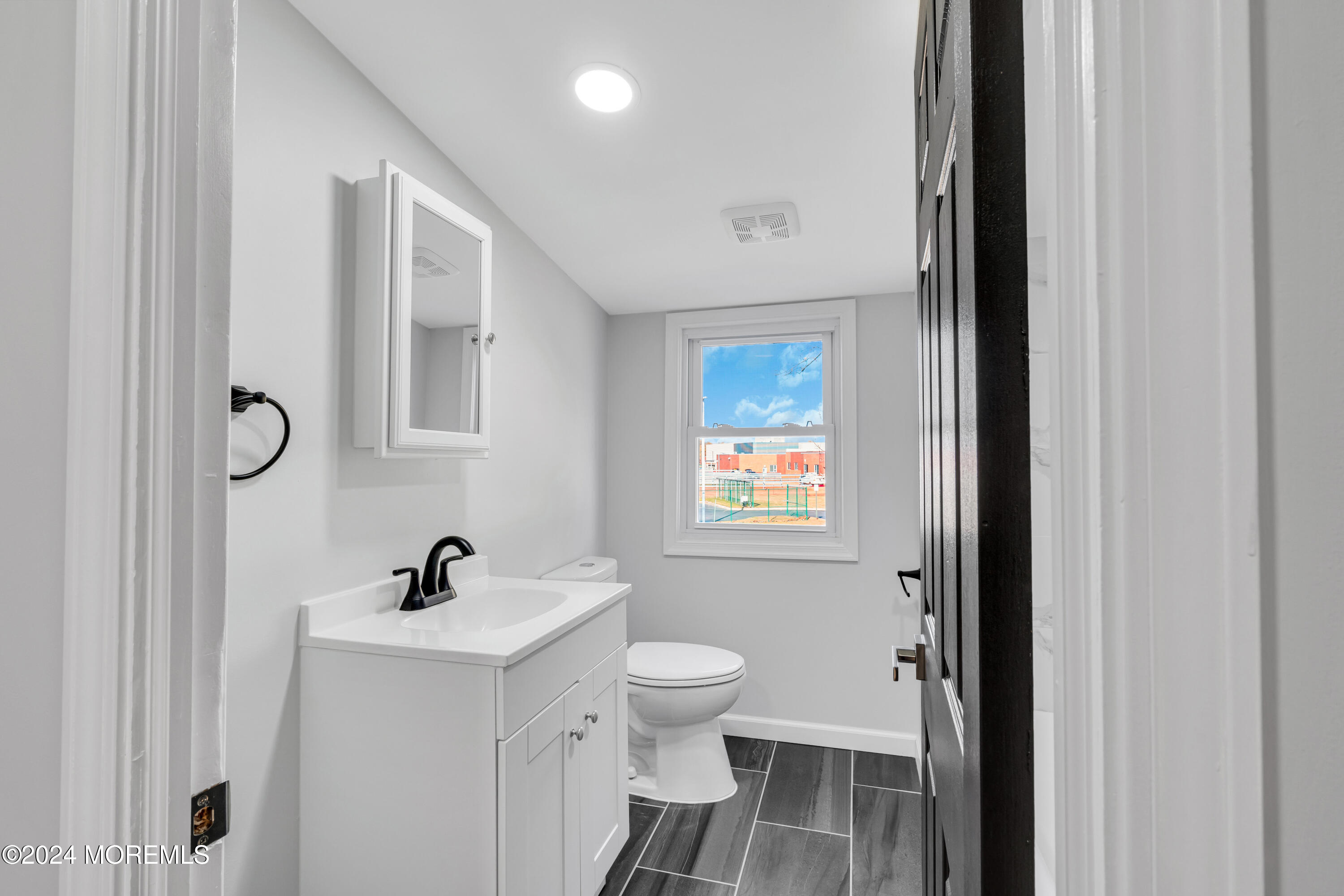 2053 Bustleton Road Burlington, NJ 08016 - Photo 47 of 55 a bathroom with a toilet a sink and mirror