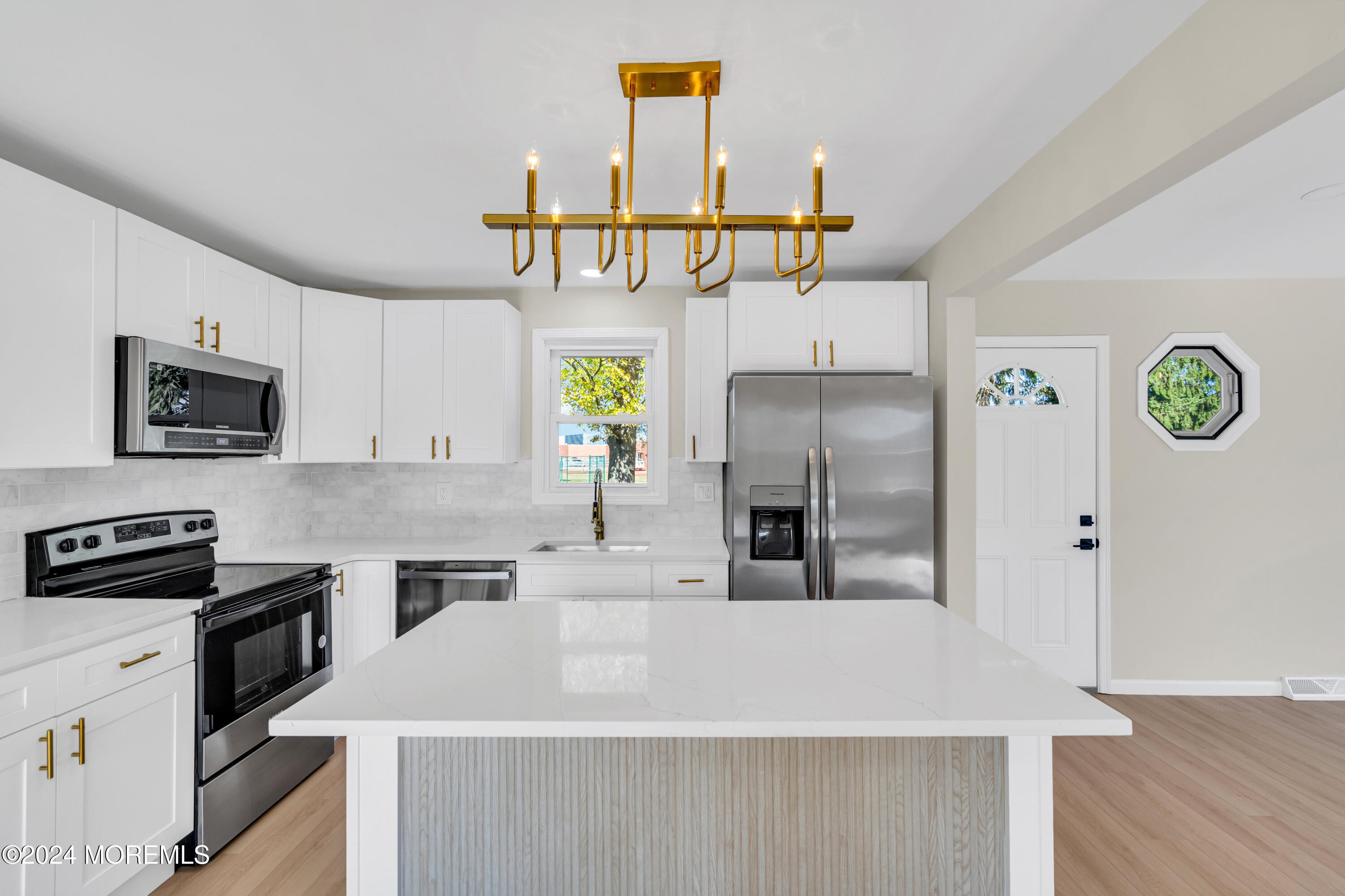 2053 Bustleton Road Burlington, NJ 08016 - Photo 5 of 55 a kitchen with stainless steel appliances a sink a microwave a refrigerator a stove and white cabinets