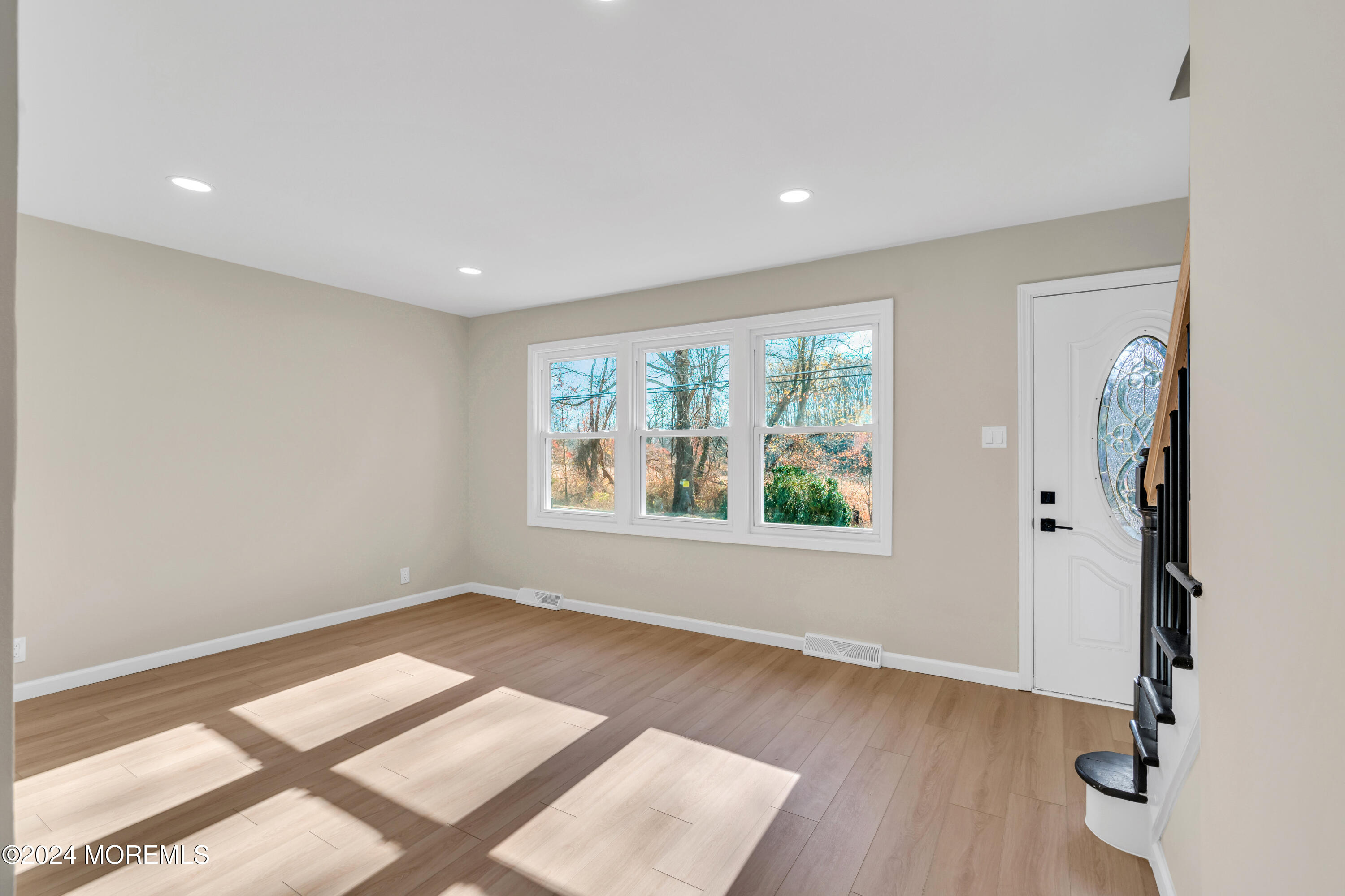 2053 Bustleton Road Burlington, NJ 08016 - Photo 8 of 55 an empty room with wooden floor and windows