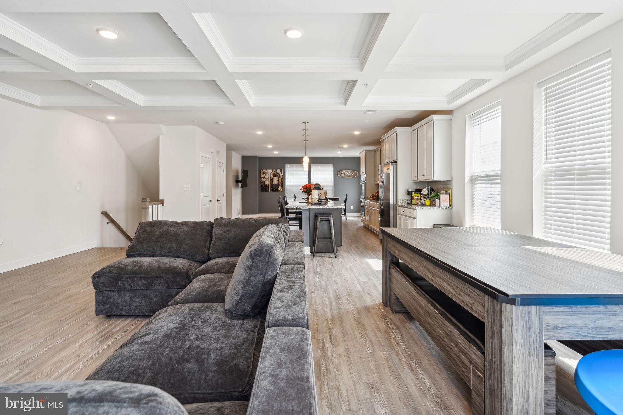 7635 Stemhart Lane Hanover, MD 21076 - Photo 14 of 28 a living room with furniture and a wooden floor