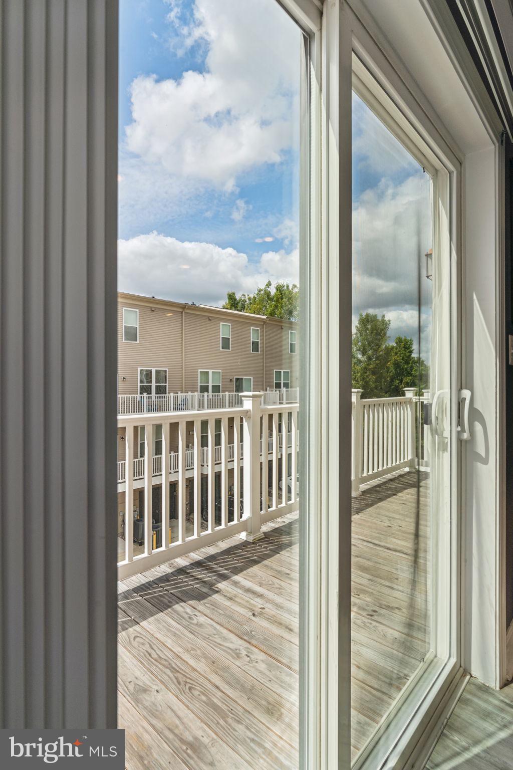 7635 Stemhart Lane Hanover, MD 21076 - Photo 15 of 28 a view of a balcony from a window