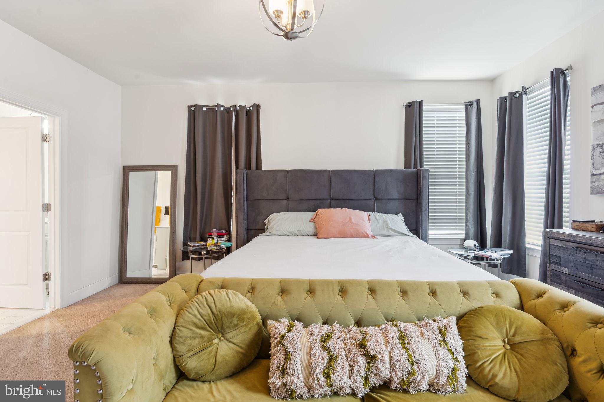 7635 Stemhart Lane Hanover, MD 21076 - Photo 21 of 28 a bedroom with a bed and window