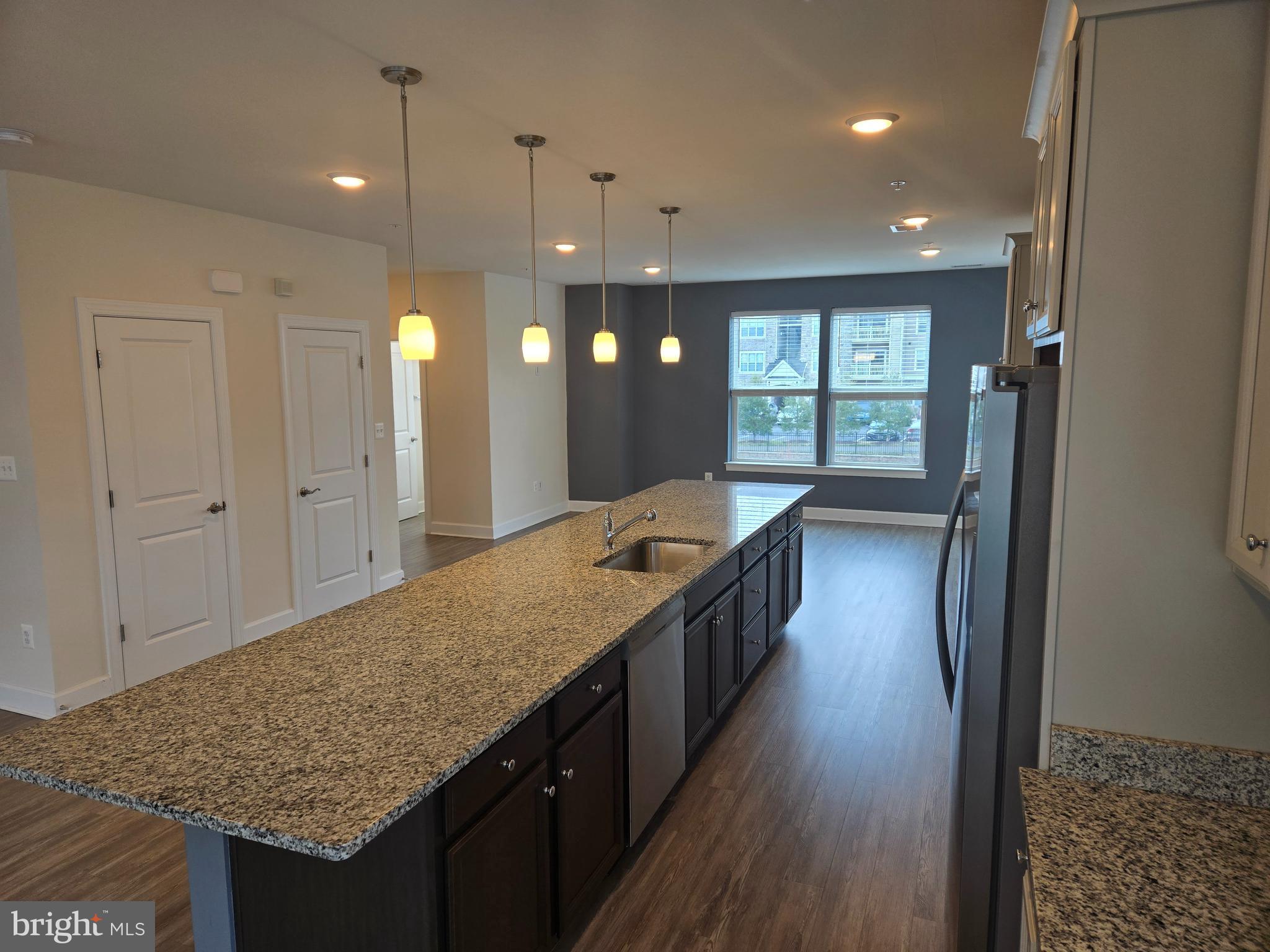 7635 Stemhart Lane Hanover, MD 21076 - Photo 6 of 28 a bathroom with a granite countertop sink a large mirror and a shower