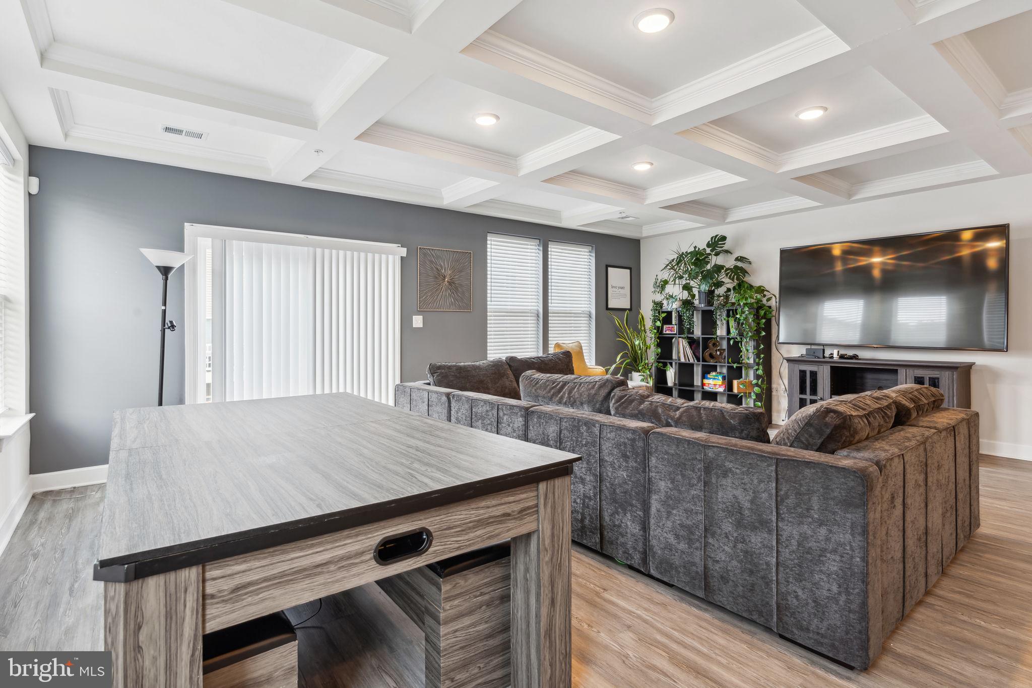 7635 Stemhart Lane Hanover, MD 21076 - Photo 10 of 28 a living room with furniture and a flat screen tv