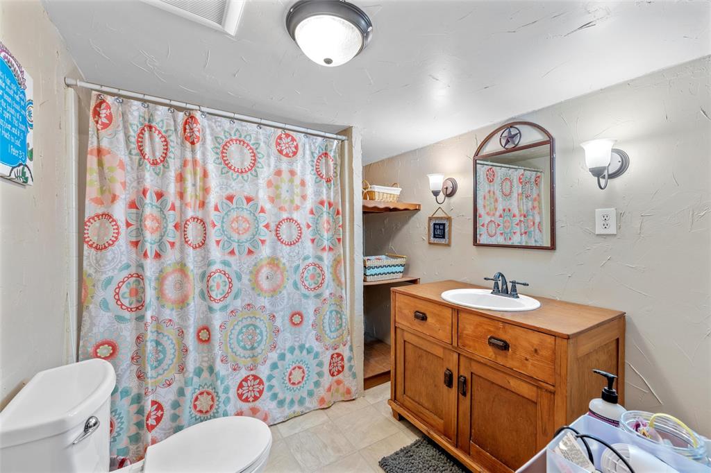 311 Cedar Ridge Drive China Spring, TX 76633 - Photo 12 of 28 Full bath featuring vanity and curtained shower