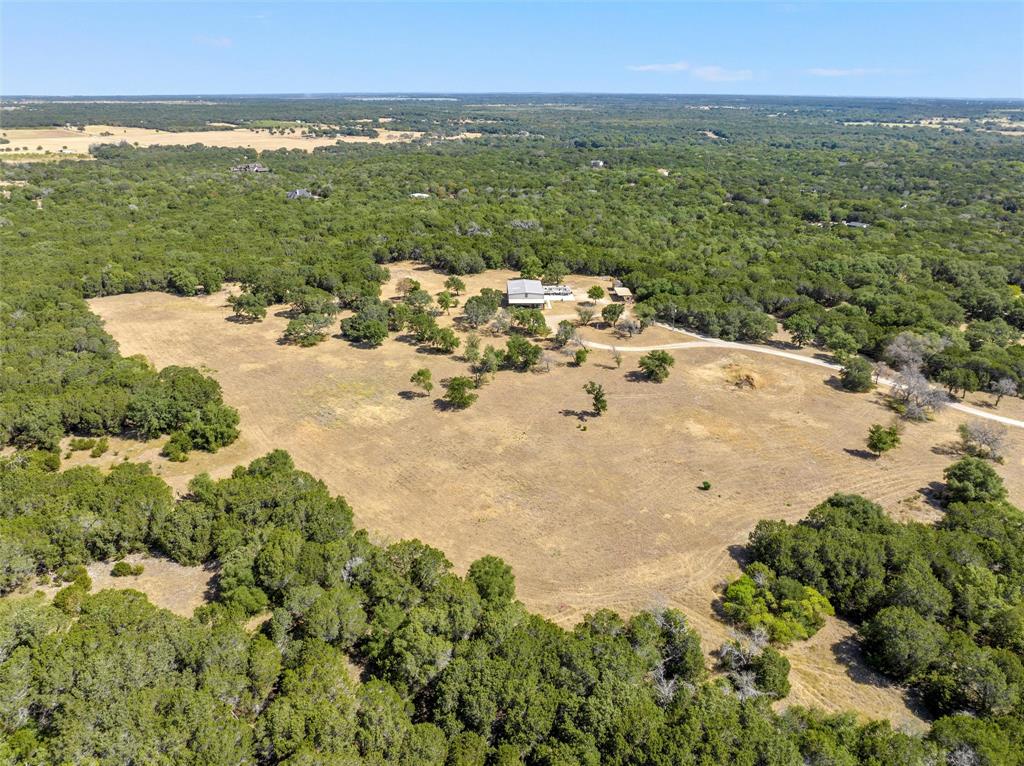 311 Cedar Ridge Drive China Spring, TX 76633 - Photo 27 of 28 Aerial overview of property's location featuring a heavily wooded area