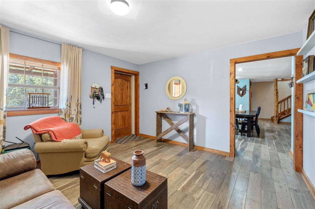 311 Cedar Ridge Drive China Spring, TX 76633 - Photo 4 of 28 Living area with light wood-style flooring and stairway