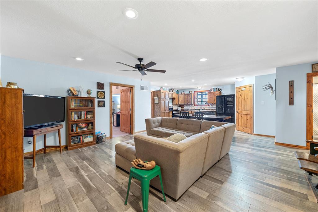 311 Cedar Ridge Drive China Spring, TX 76633 - Photo 5 of 28 Living room featuring light wood-style flooring, recessed lighting, and a ceiling fan