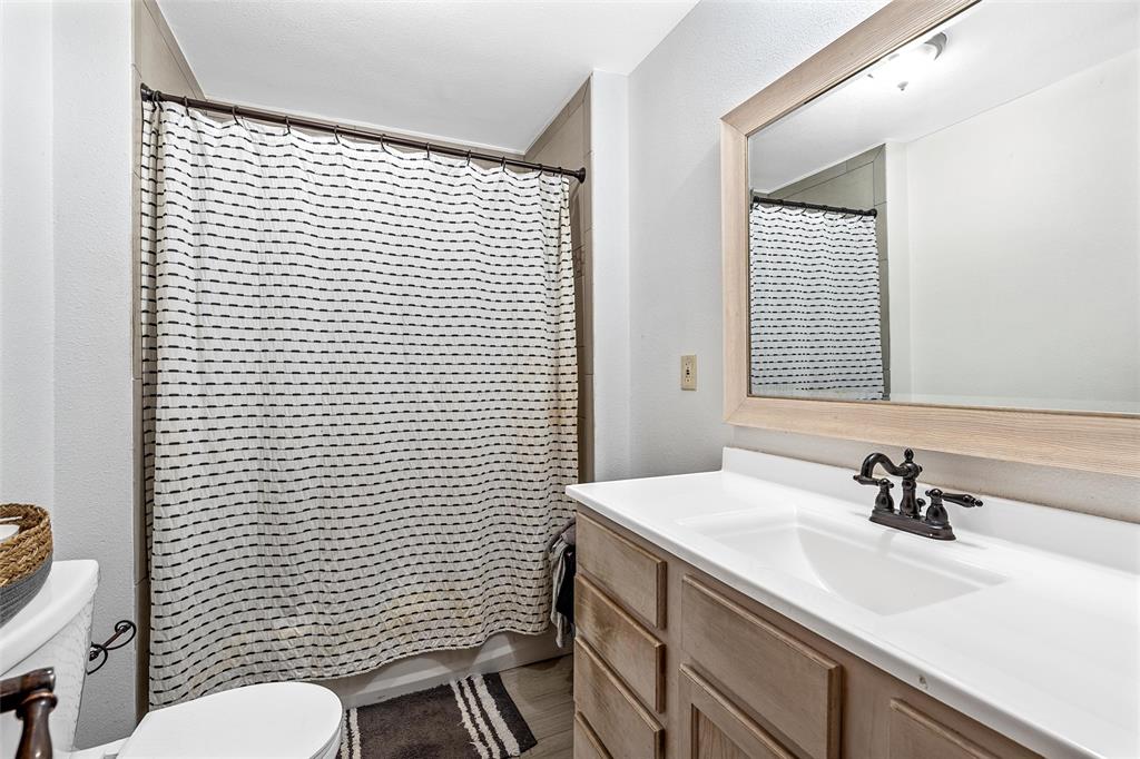 311 Cedar Ridge Drive China Spring, TX 76633 - Photo 9 of 28 Bathroom with vanity and curtained shower