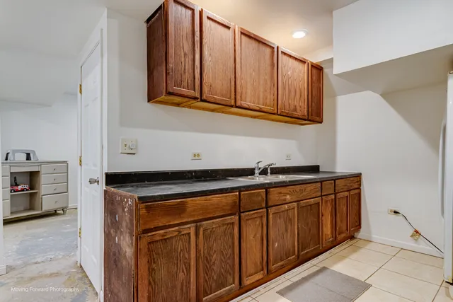 a kitchen with stainless steel appliances granite countertop a sink and cabinets