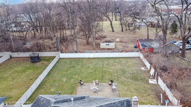 a view of a yard with a sitting area