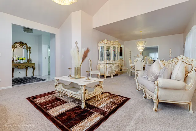 a living room with furniture and a table