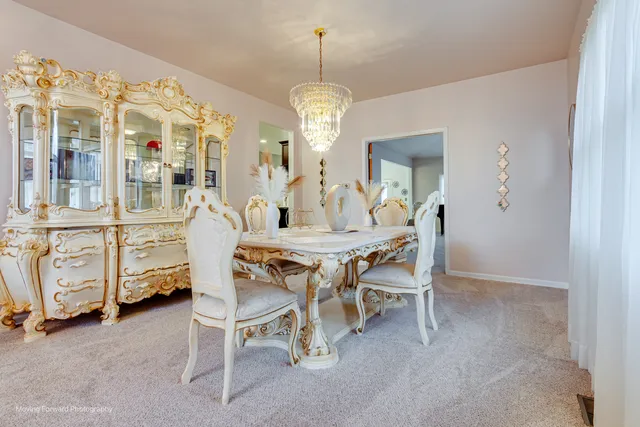 a dining room with furniture and window