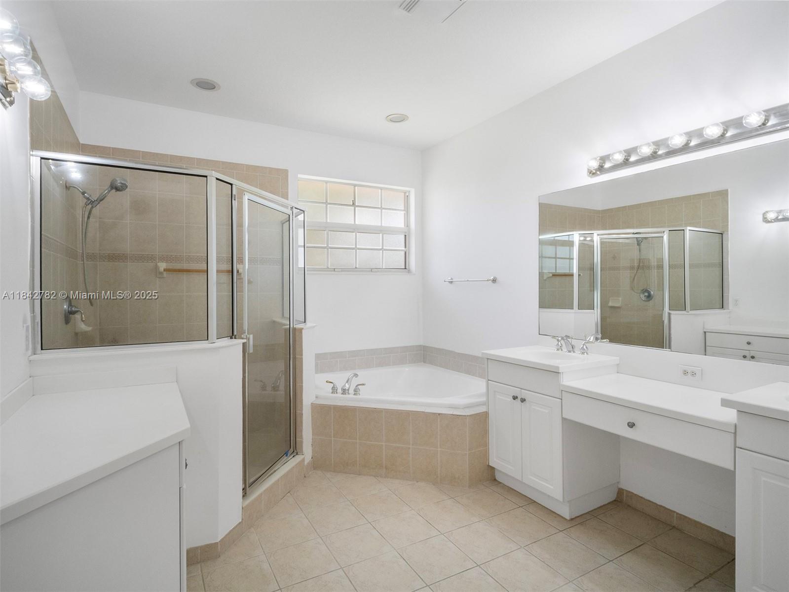 43 Lancaster Road Boynton Beach, FL 33426 - Photo 15 of 29 a bathroom with a tub sink shower and mirror