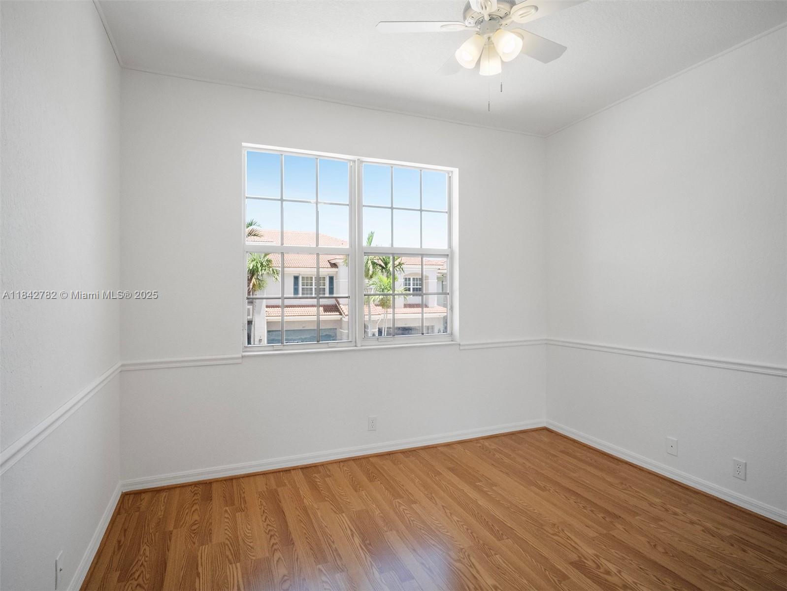 43 Lancaster Road Boynton Beach, FL 33426 - Photo 18 of 29 a room with wooden floor and window