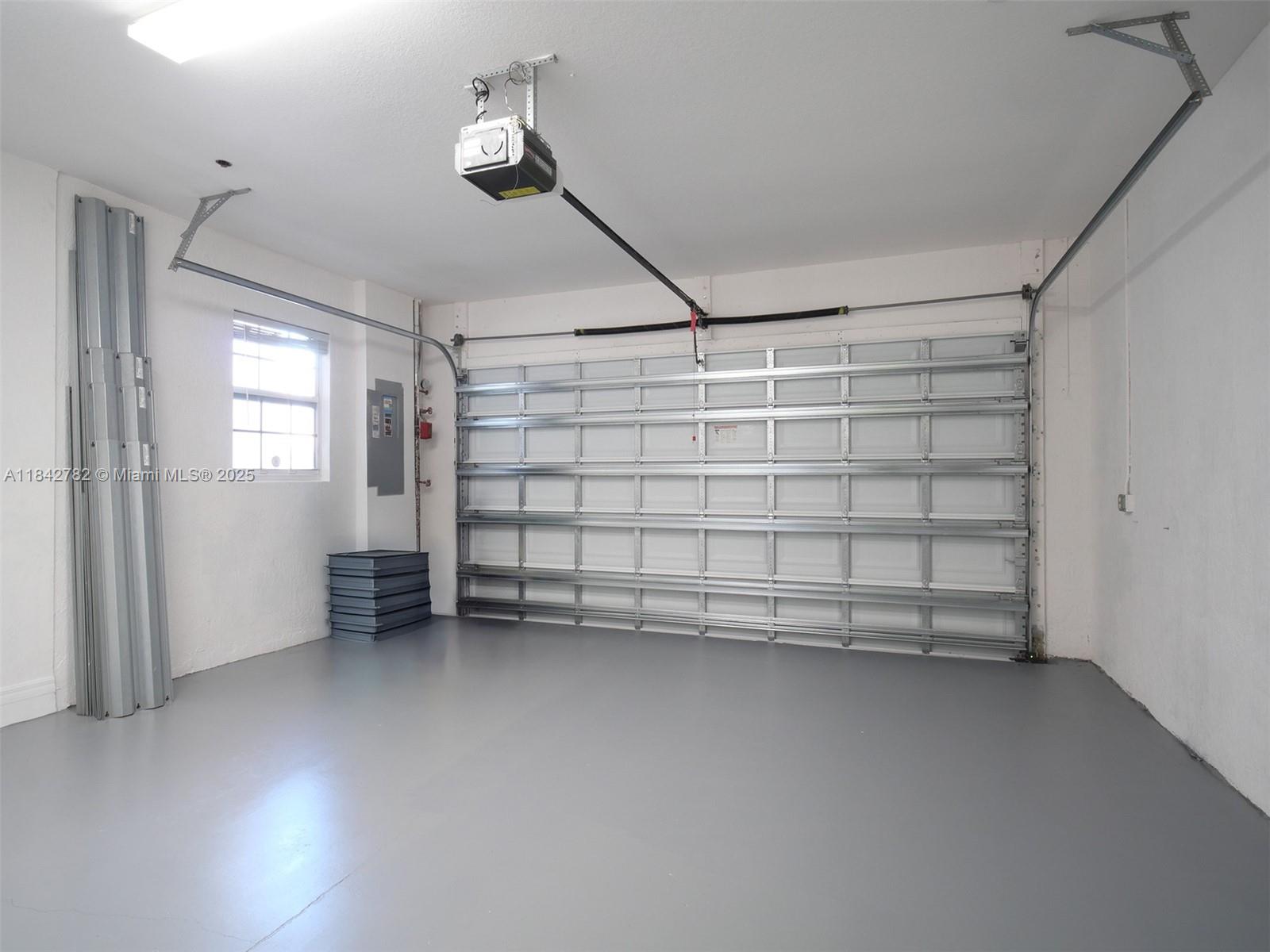 43 Lancaster Road Boynton Beach, FL 33426 - Photo 23 of 29 a view of a garage room with stairs