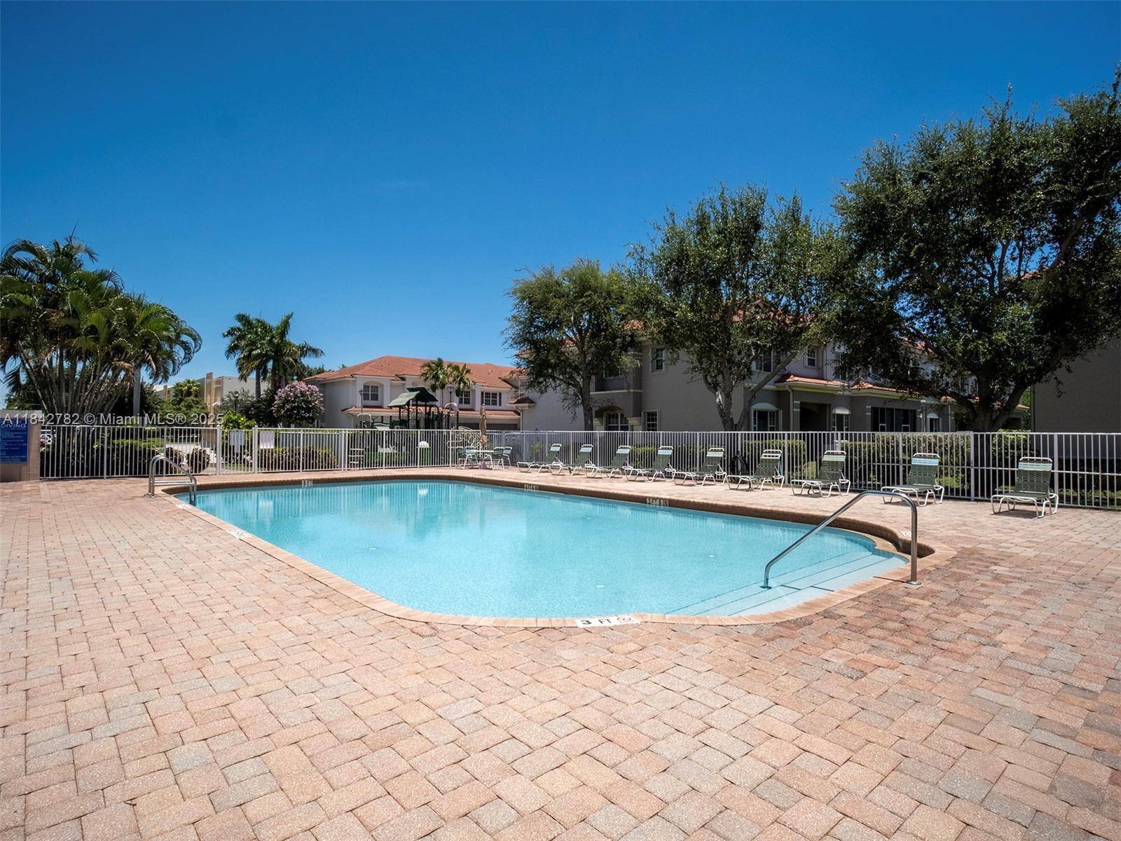 43 Lancaster Road Boynton Beach, FL 33426 - Photo 27 of 29 a view of a swimming pool with an outdoor seating