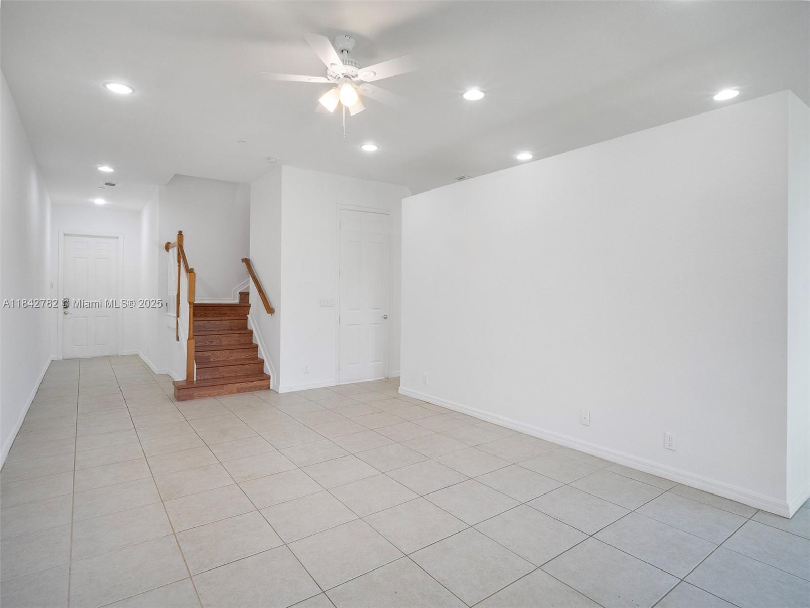 43 Lancaster Road Boynton Beach, FL 33426 - Photo 6 of 29 an empty room with white walls and ceiling fan