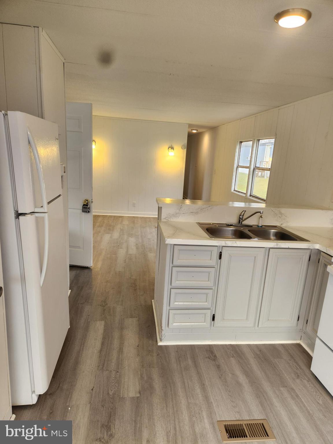 46 Chipawa Avenue Dover, PA 17315 - Photo 3 of 12 a room with wooden floor and cabinets