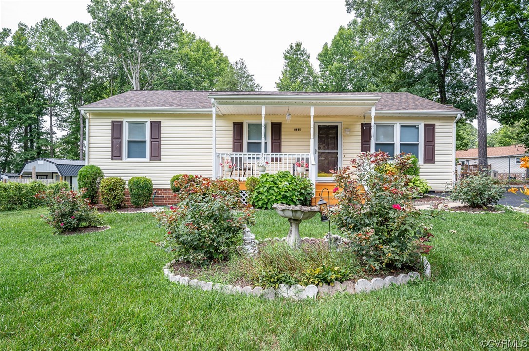 4212 Bridgewood Road Midlothian, VA 23112 - Photo 1 of 27 a view of a house with a yard and plants