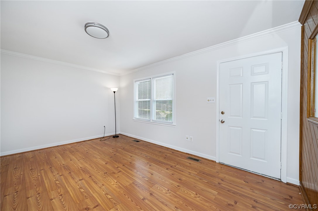 4212 Bridgewood Road Midlothian, VA 23112 - Photo 7 of 27 a view of empty room with wooden floor and fan