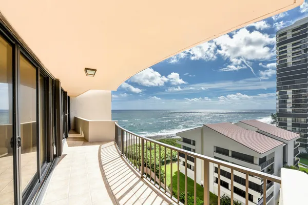 a view of balcony with furniture