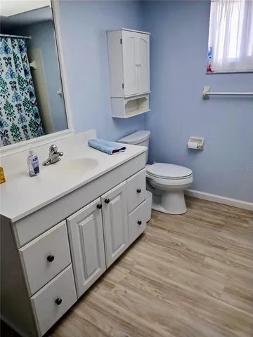 a bedroom with a bed and a tv