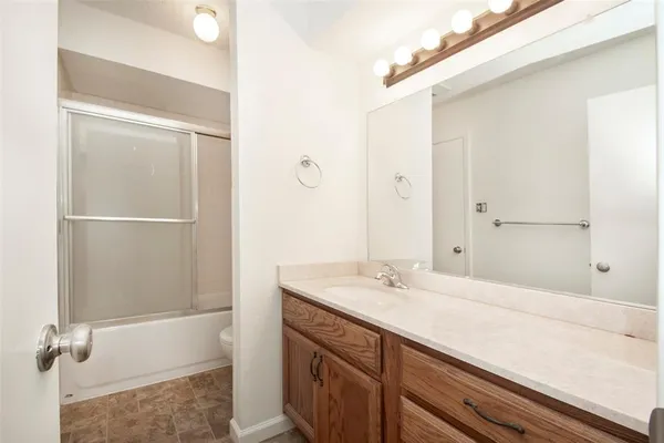 a bathroom with a bathtub and a sink
