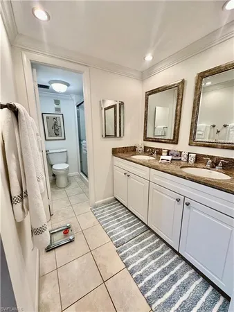 a kitchen with a sink and a stove top oven