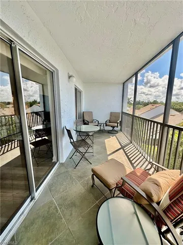 a view of balcony with furniture
