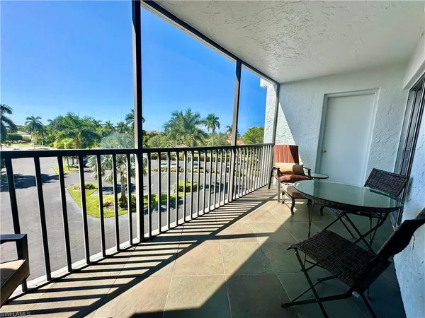 a view of a patio with wooden floor