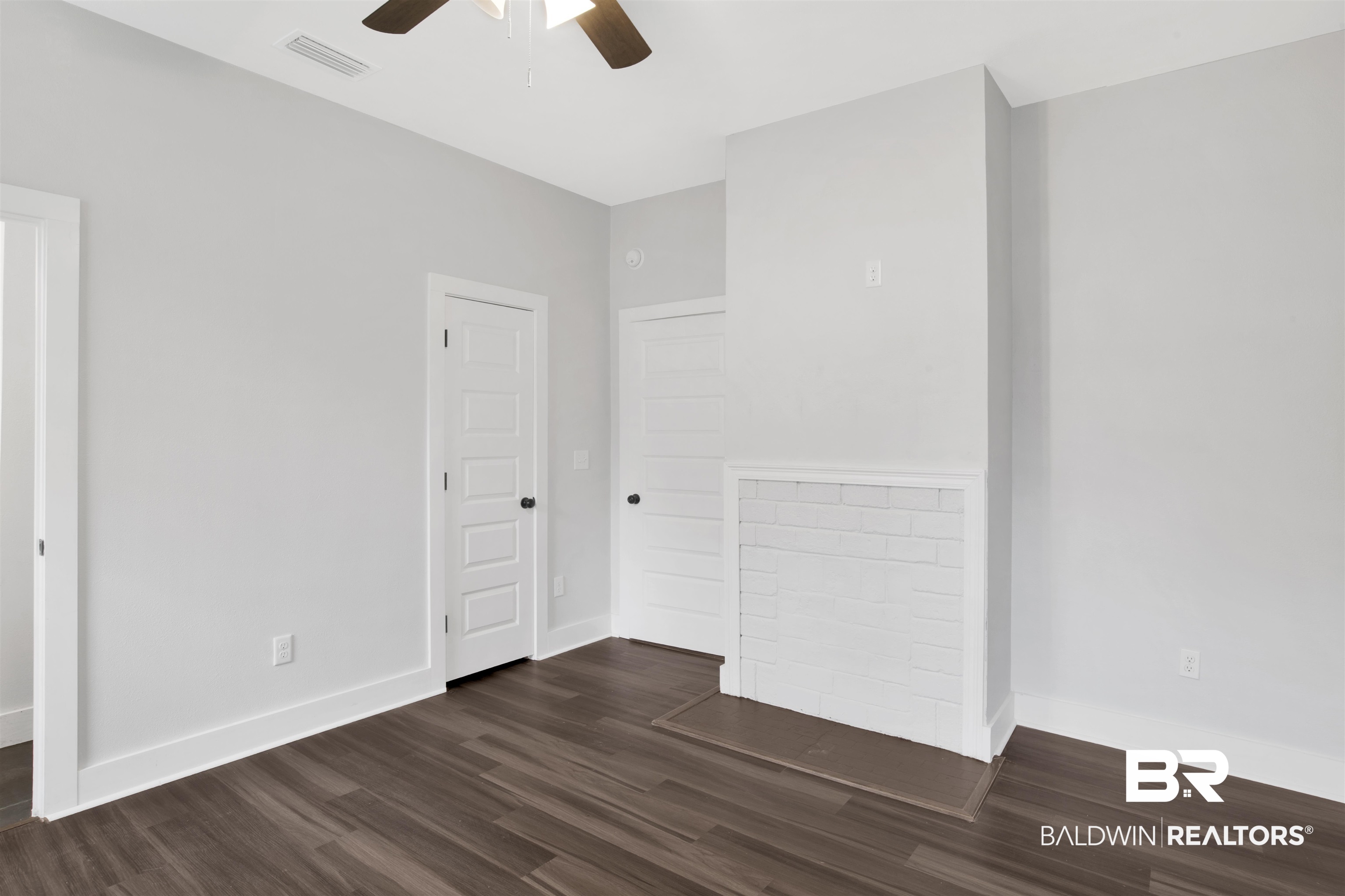 302 1st Street Mobile, AL 36611 - Photo 20 of 28 Spare room featuring dark wood-type flooring and ceiling fan