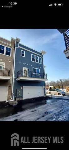 a view of a two chairs in the balcony