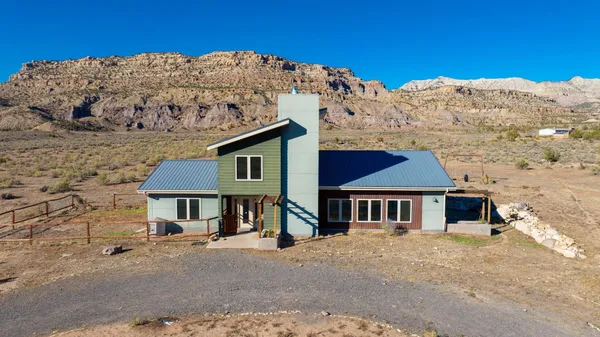 front view of a house with a mountain