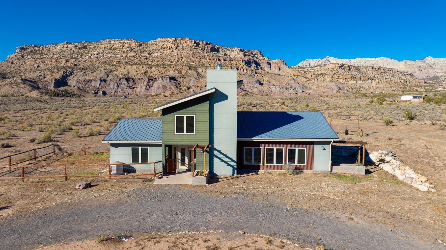 front view of a house with a mountain