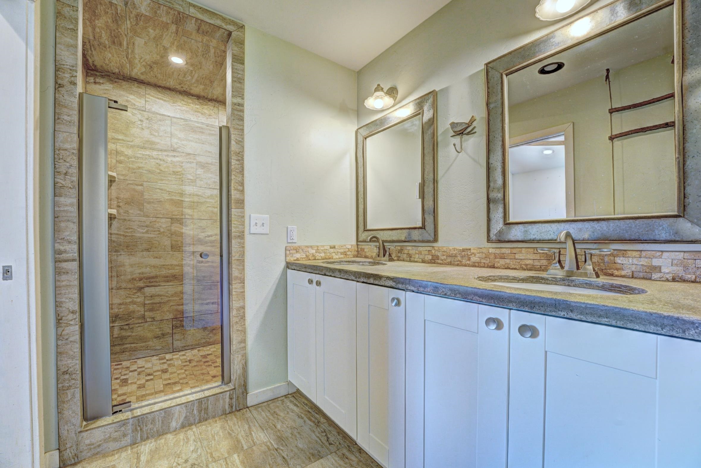 1570-45 45 1/2 Road De Beque, CO 81630 - Photo 13 of 35 a bathroom with double sink and a mirror