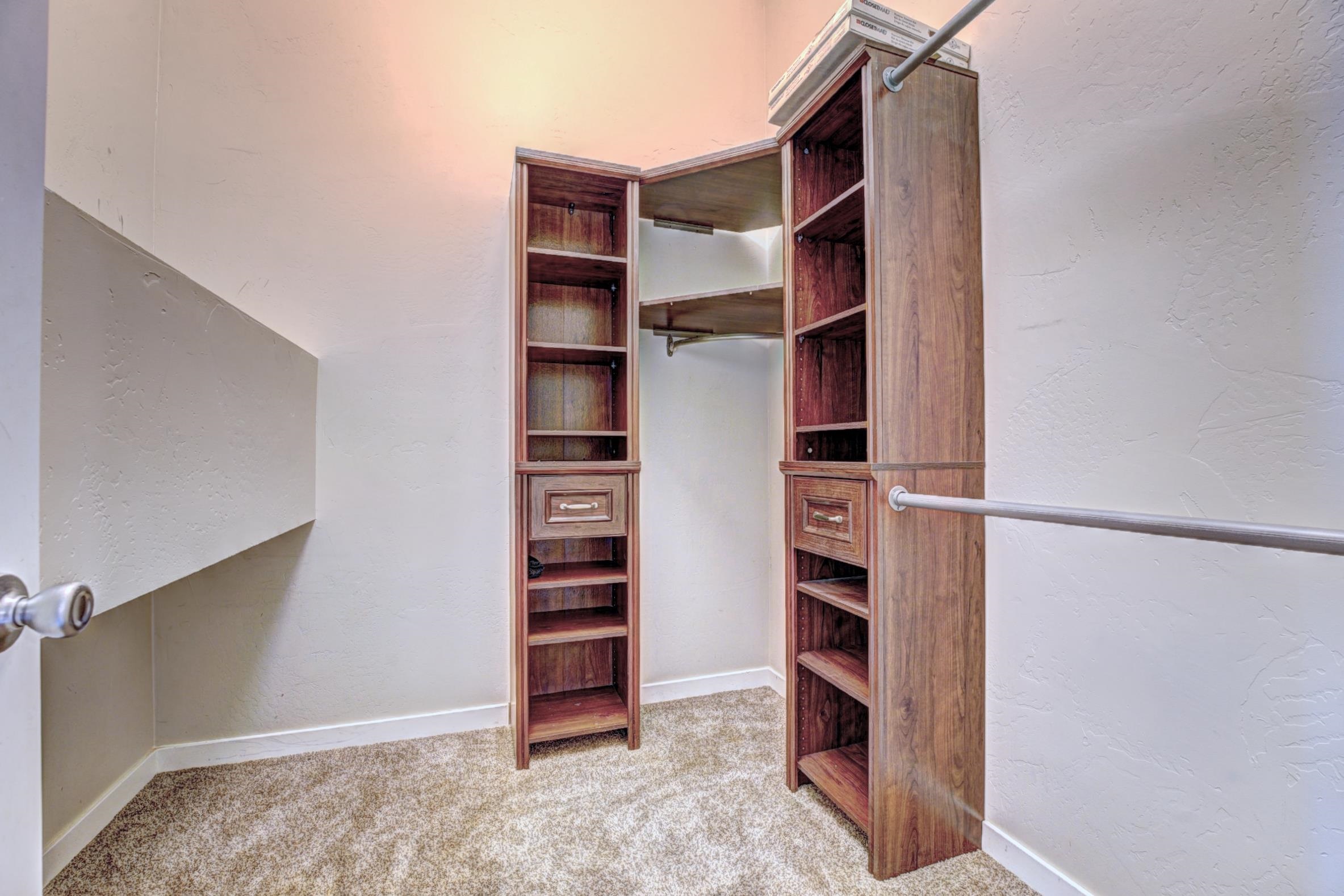 1570-45 45 1/2 Road De Beque, CO 81630 - Photo 14 of 35 a view of walk in closet with empty racks