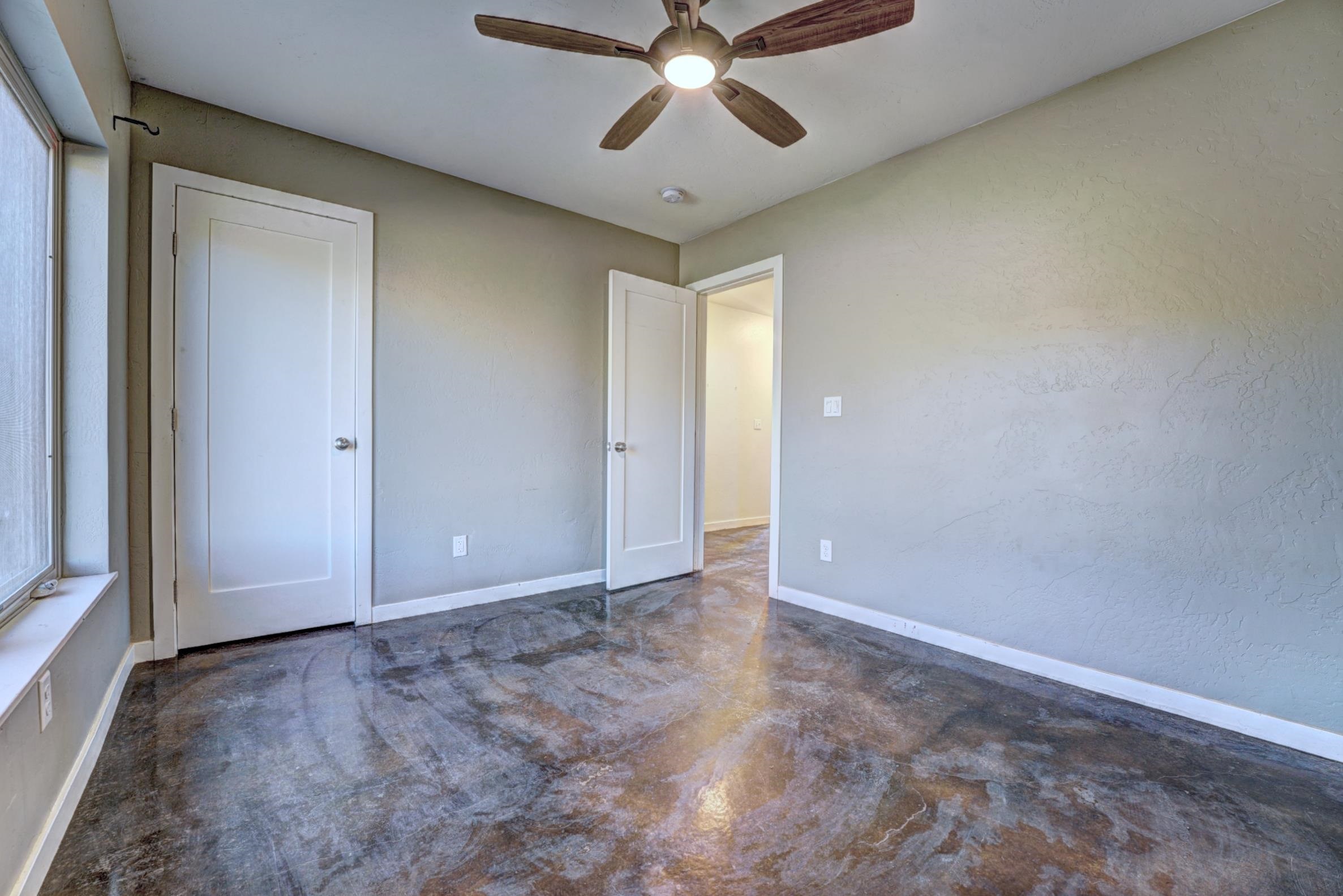 1570-45 45 1/2 Road De Beque, CO 81630 - Photo 20 of 35 an empty room with closet and a chandelier fan