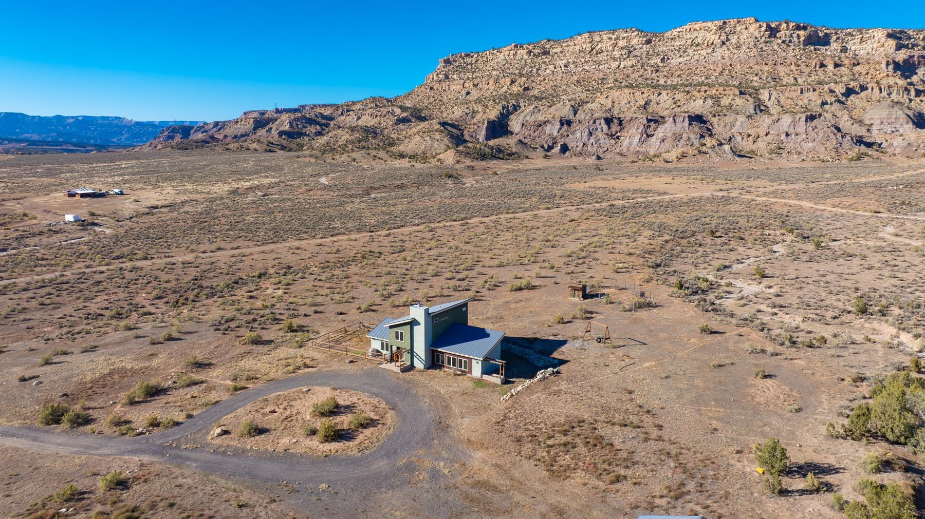 1570-45 45 1/2 Road De Beque, CO 81630 - Photo 2 of 35 a view of a dry yard with mountain view