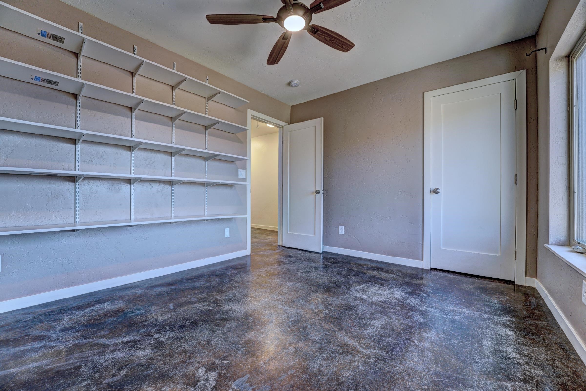 1570-45 45 1/2 Road De Beque, CO 81630 - Photo 23 of 35 a view of an empty room with a cabinet and a window