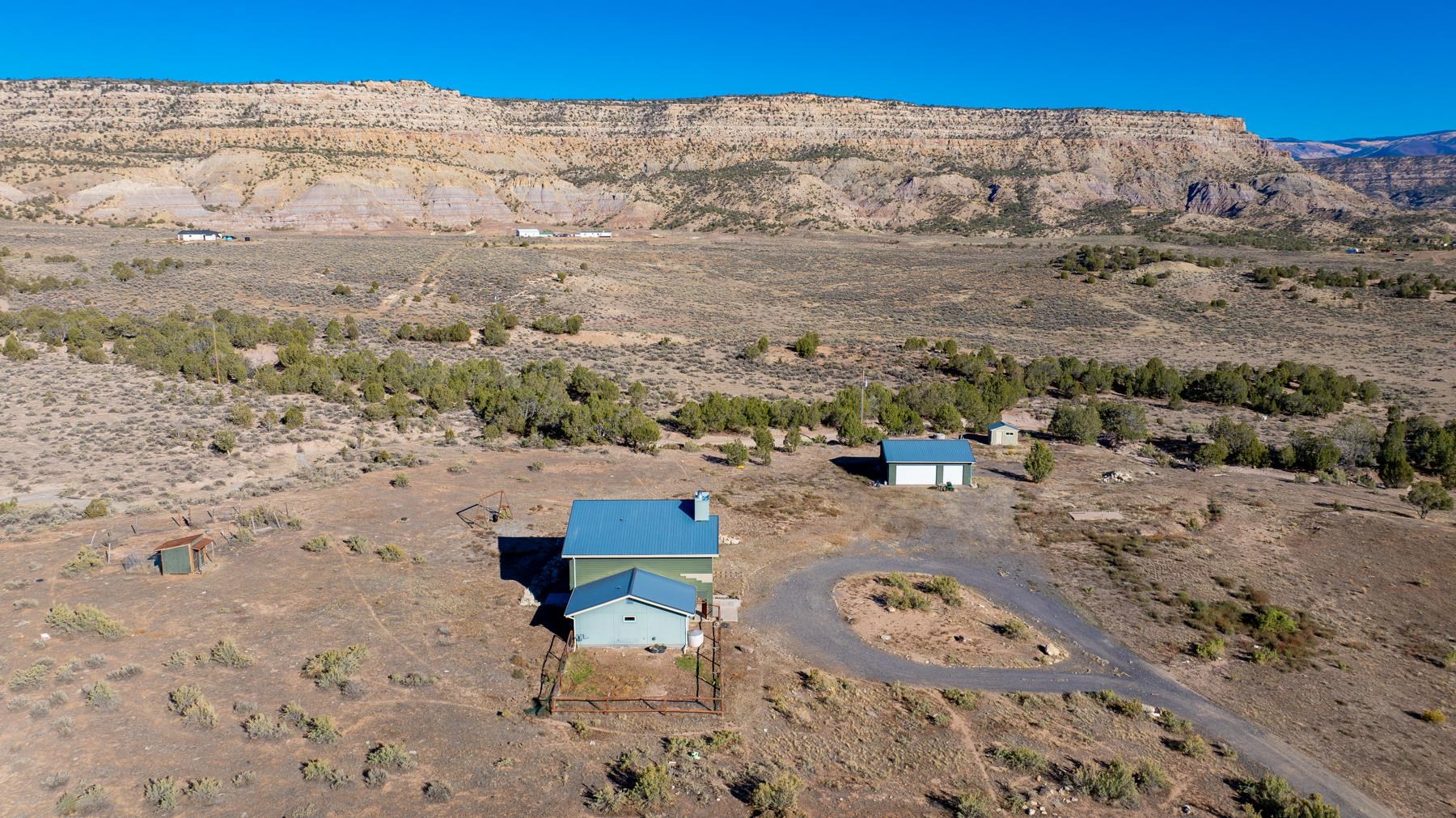 1570-45 45 1/2 Road De Beque, CO 81630 - Photo 29 of 35 a view of a backyard with wooden fence