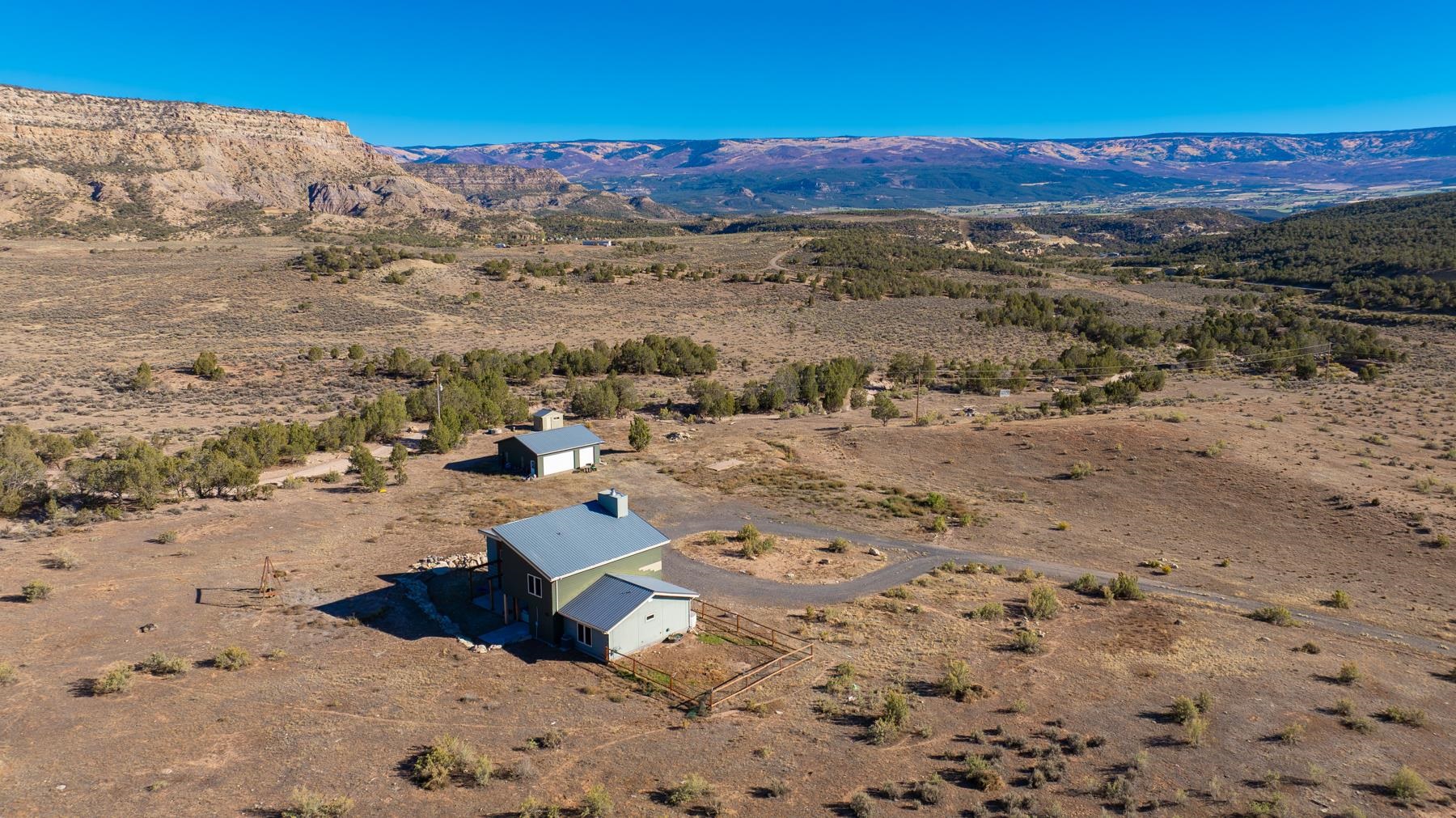 1570-45 45 1/2 Road De Beque, CO 81630 - Photo 30 of 35 a view of a road with mountains in the background