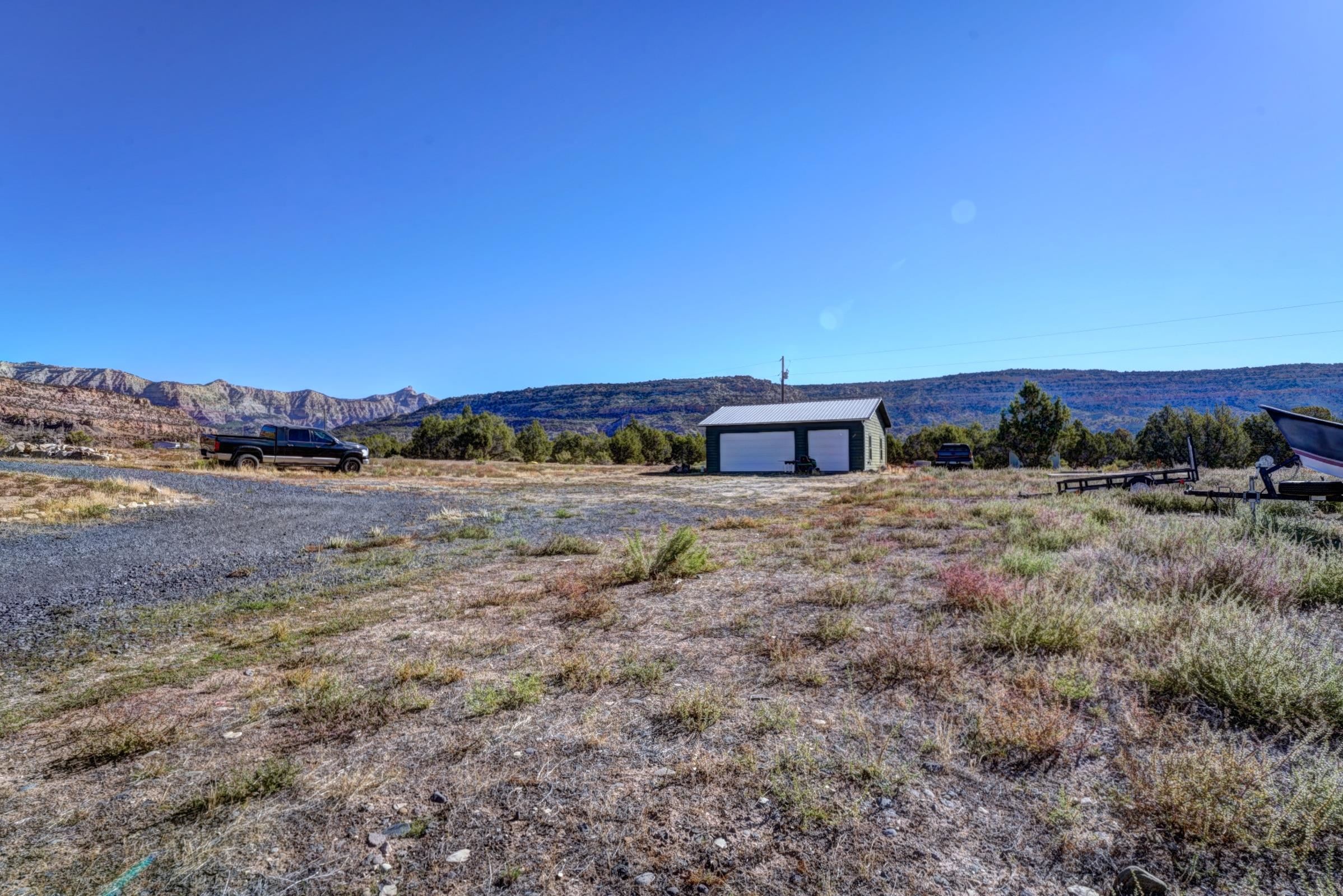 1570-45 45 1/2 Road De Beque, CO 81630 - Photo 32 of 35 a view of a yard with an outdoor space